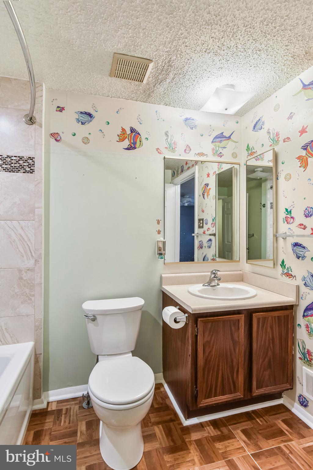 5825 High Bluff Court Burke, VA 22015 - Photo 32 of 52 a bathroom with a granite countertop toilet sink and mirror