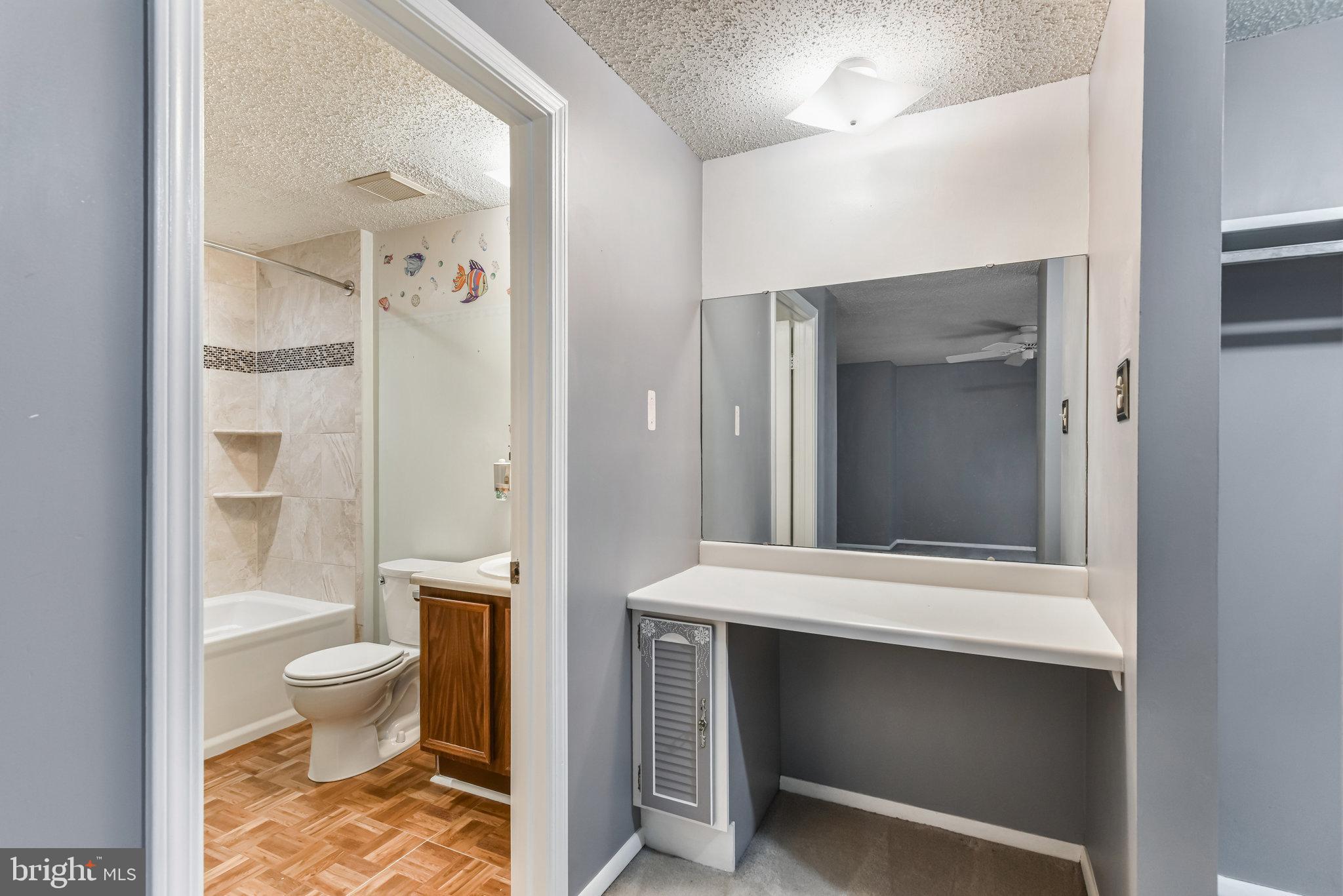 5825 High Bluff Court Burke, VA 22015 - Photo 33 of 52 a bathroom with a toilet sink and shower