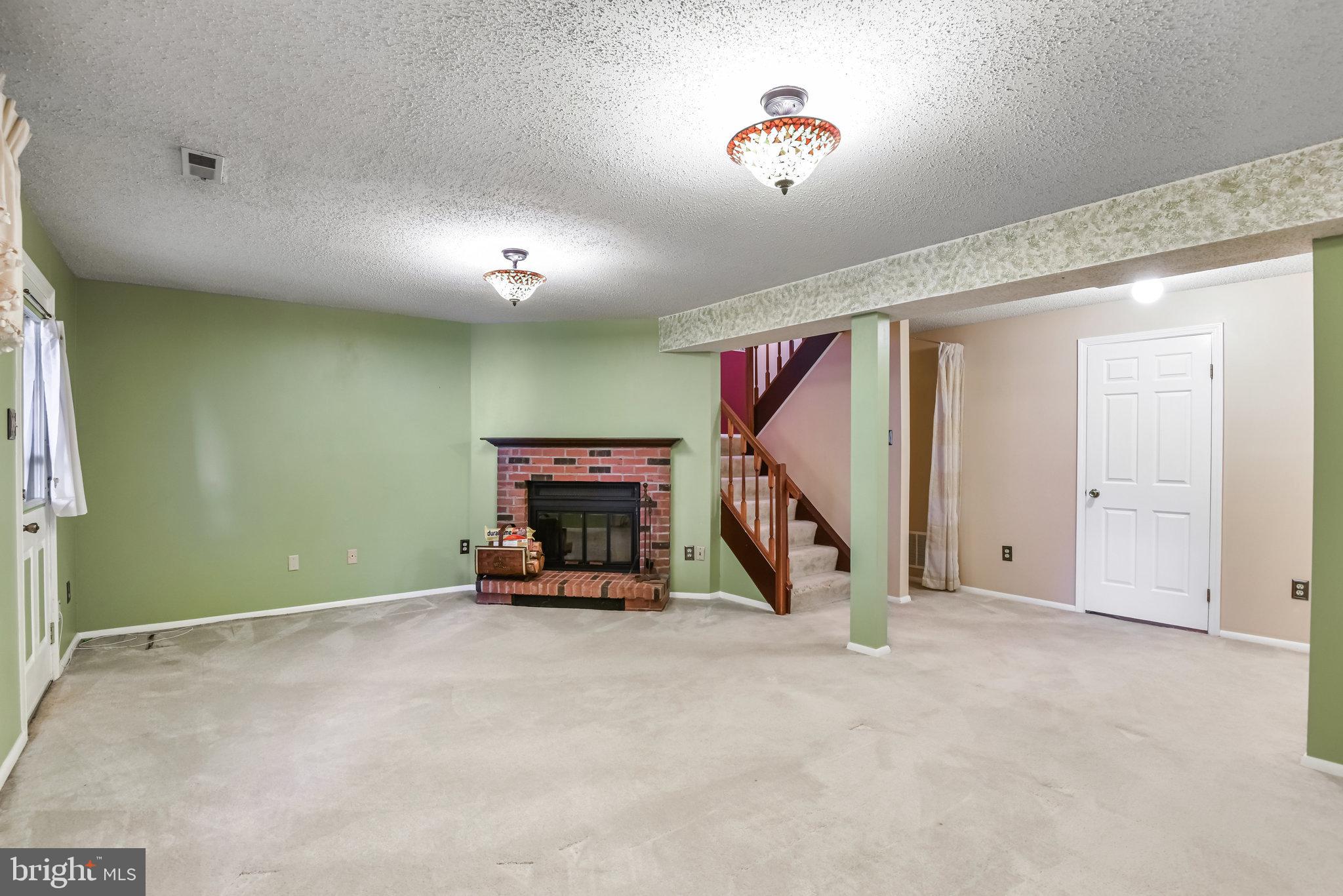5825 High Bluff Court Burke, VA 22015 - Photo 36 of 52 a view of a room with gym equipment