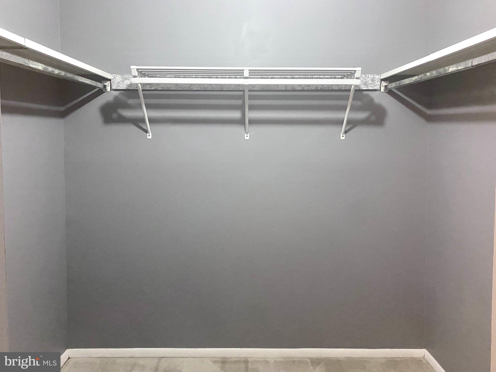 5825 High Bluff Court Burke, VA 22015 - Photo 38 of 52 a view of a room with racks on the wall