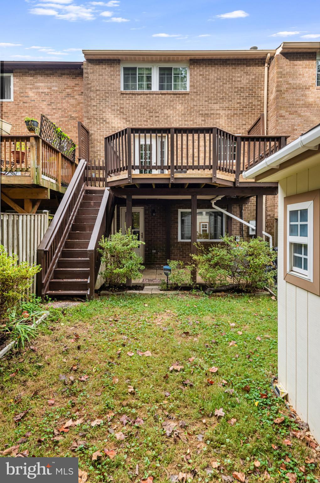 5825 High Bluff Court Burke, VA 22015 - Photo 50 of 52 a view of a house with pool and sitting area