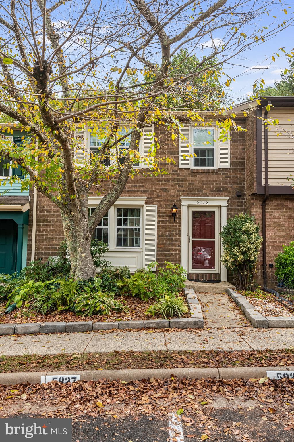 5825 High Bluff Court Burke, VA 22015 - Photo 5 of 52 a front view of a house with a yard