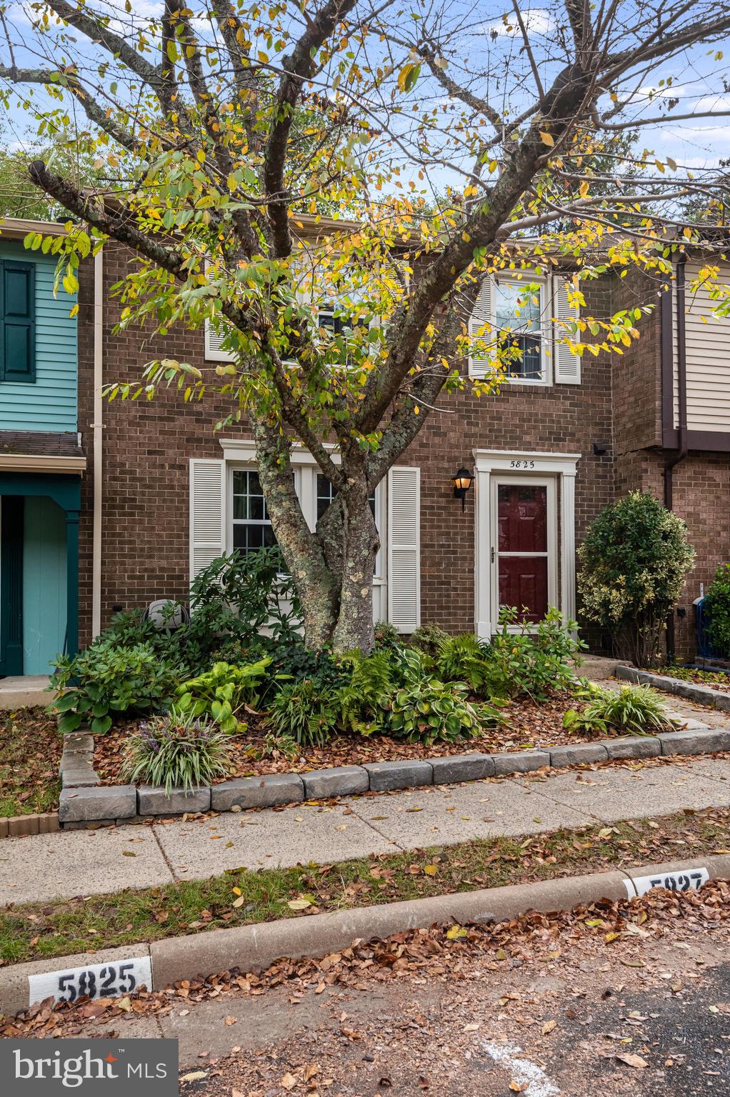 5825 High Bluff Court Burke, VA 22015 - Photo 6 of 52 a front view of a house with garden