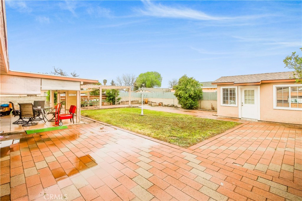 4635 Merced Avenue Baldwin Park, CA 91706 - Photo 14 of 18 a view of a swimming pool with an outdoor space and seating area