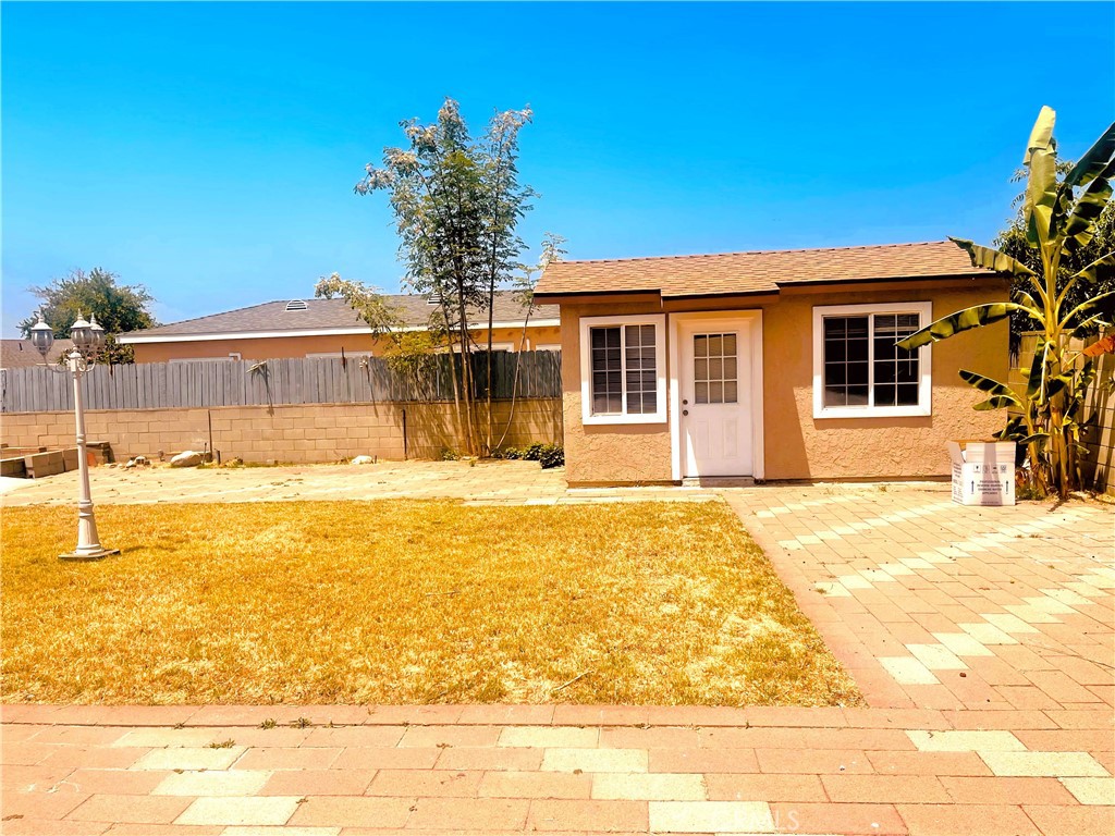 4635 Merced Avenue Baldwin Park, CA 91706 - Photo 15 of 18 a view of a house with a swimming pool