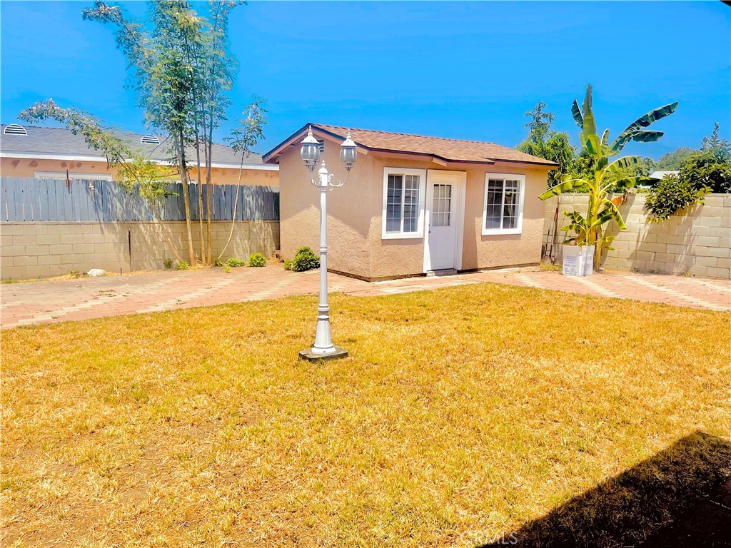 4635 Merced Avenue Baldwin Park, CA 91706 - Photo 16 of 18 a front view of a house with a yard