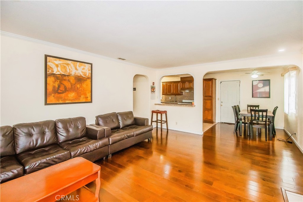 4635 Merced Avenue Baldwin Park, CA 91706 - Photo 2 of 18 a living room with furniture and kitchen view