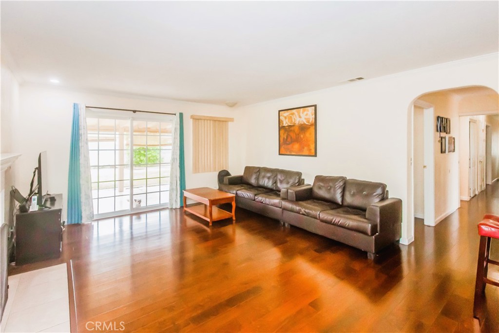 4635 Merced Avenue Baldwin Park, CA 91706 - Photo 3 of 18 a living room with furniture and a large window