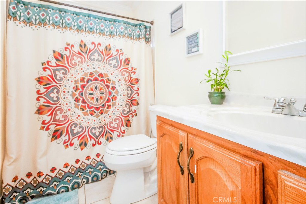 4635 Merced Avenue Baldwin Park, CA 91706 - Photo 6 of 18 a bathroom with a sink toilet and shower