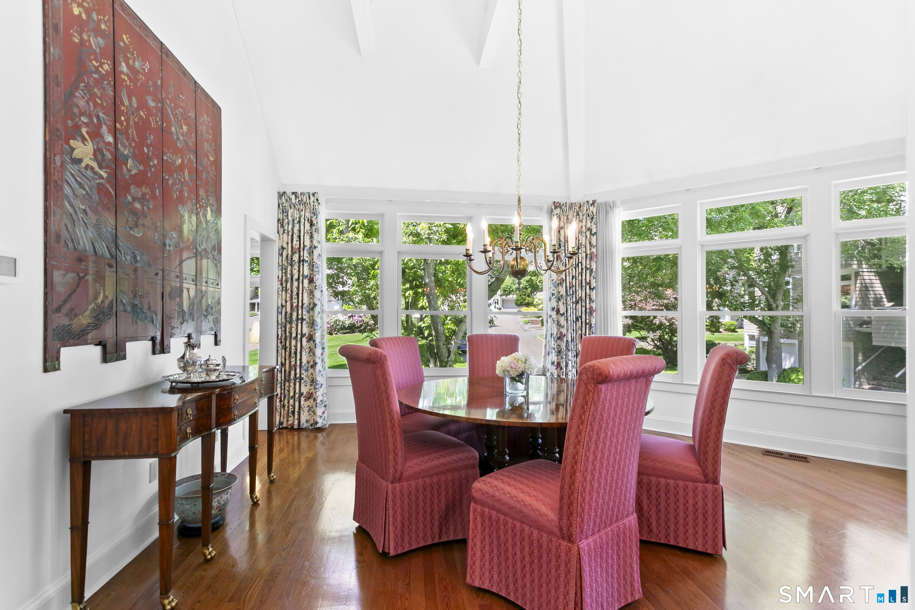 936 South Pine Creek Road Fairfield, CT 06824 - Photo 13 of 39 Formal dining room with vaulted ceiling and a wall of windows. This room could also be the third bedroom with full bath and walk in closet.