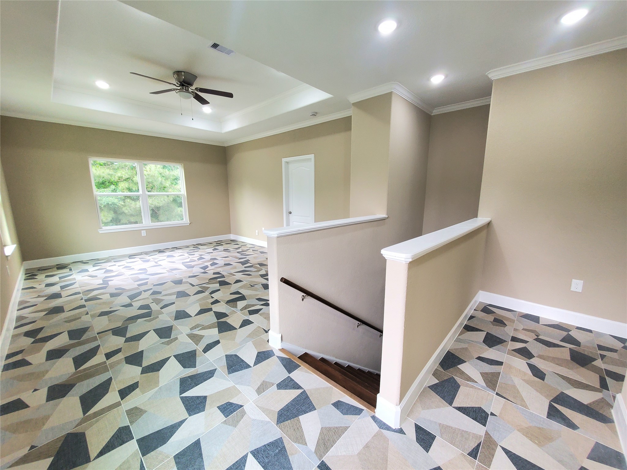 1306 North 9th Street Conroe, TX 77301 - Photo 14 of 47 a view of a hallway with front door and wooden floor