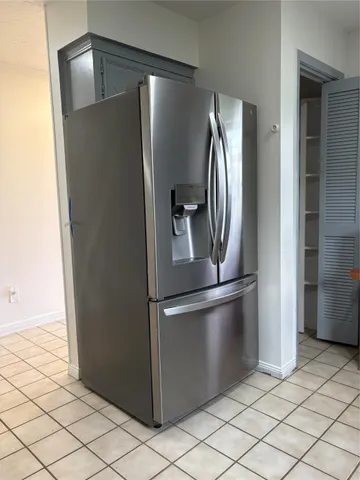 a living room with a fireplace and a window