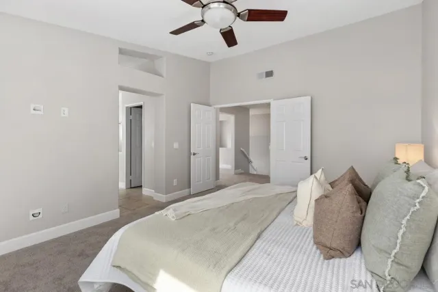 a bedroom with a bed and window