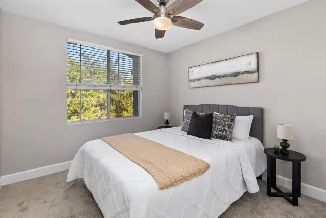 a bedroom with a bed and window