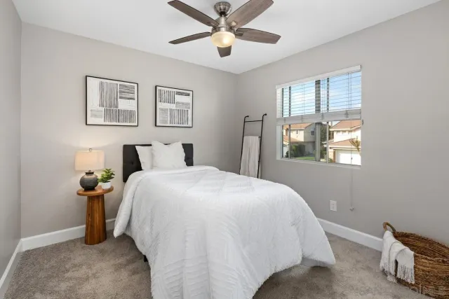 a bed room with a bed and a window