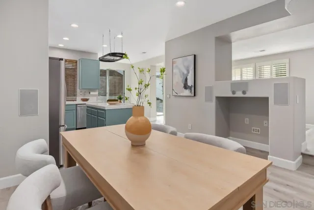 a dining room with a table and chairs