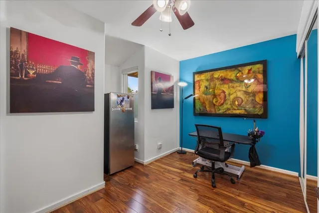 a bathroom with a sink mirror and toilet