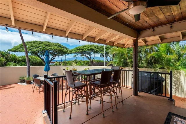 a outdoor space with a table and chairs
