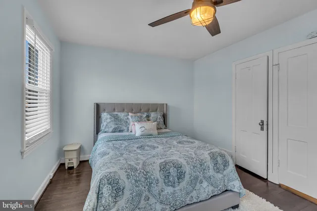 a bedroom with a large bed and a window