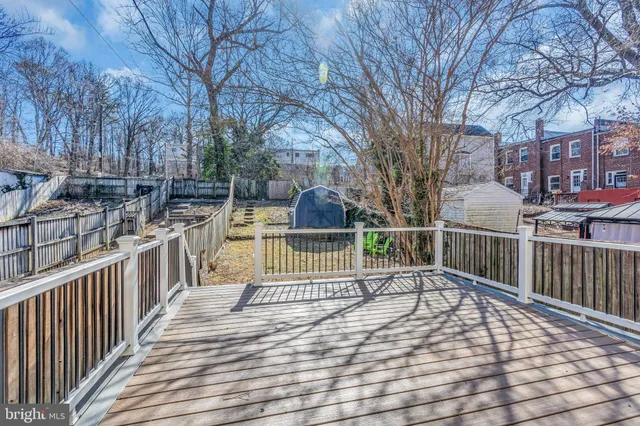 a view of a house with wooden deck