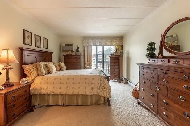 a bedroom with bed and window