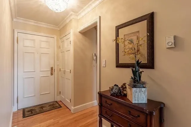 a view of a workspace with furniture and wooden floor