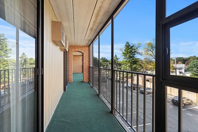 a view of a porch with a floor to ceiling window