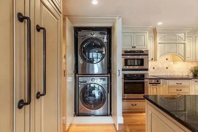 a view of a kitchen with washer and dryer
