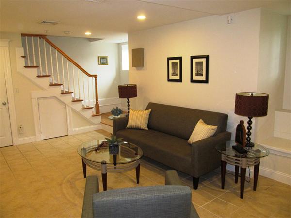 16 Decatur Street, Unit 16 Cambridge, MA 02139 - Photo 7 of 9 a living room with furniture and a lamp
