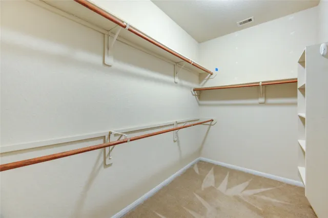 a view of a room with racks on the wall