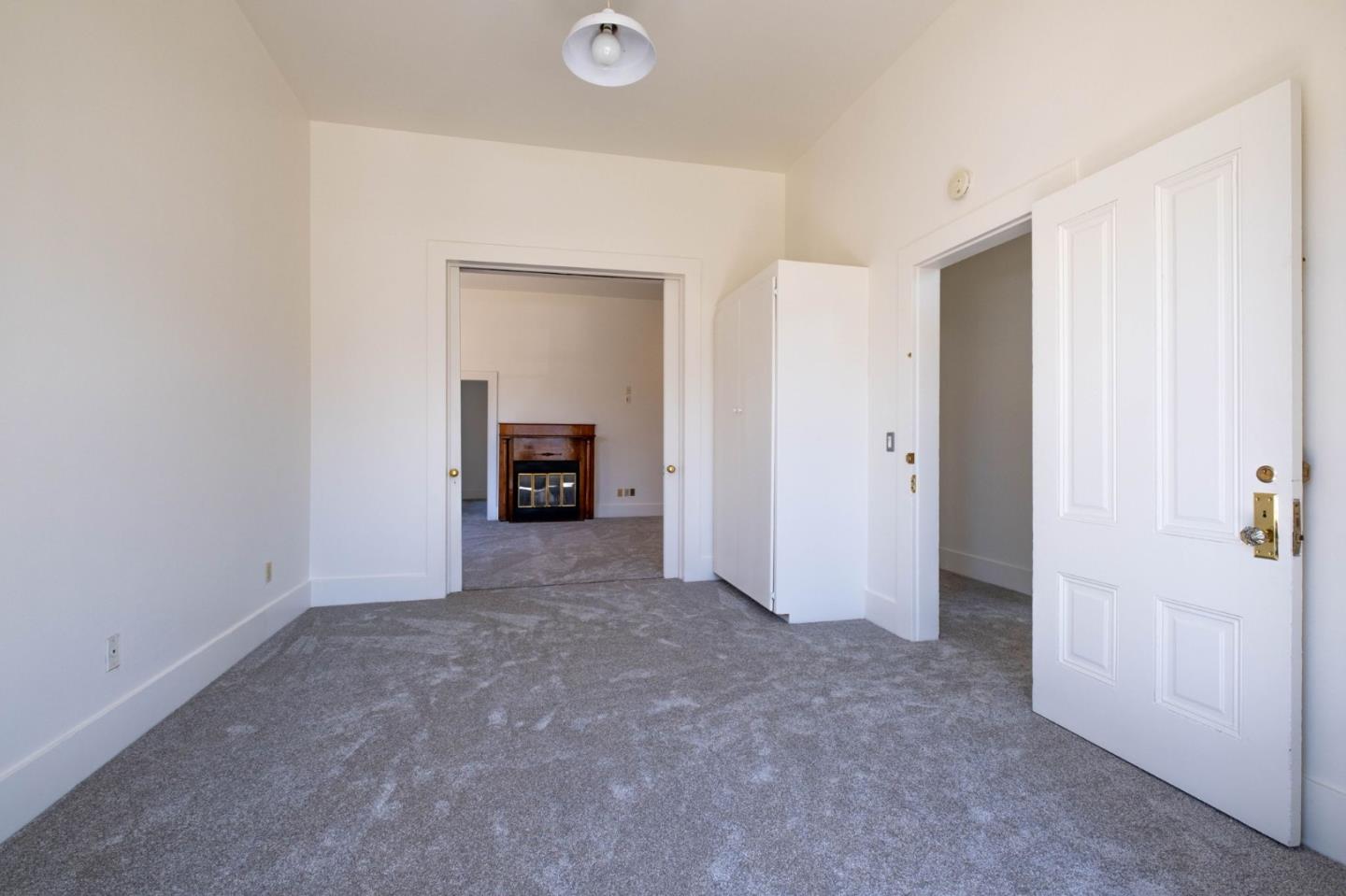 120 Maple Street Santa Cruz, CA 95060 - Photo 14 of 29 an empty room with an entrance and door