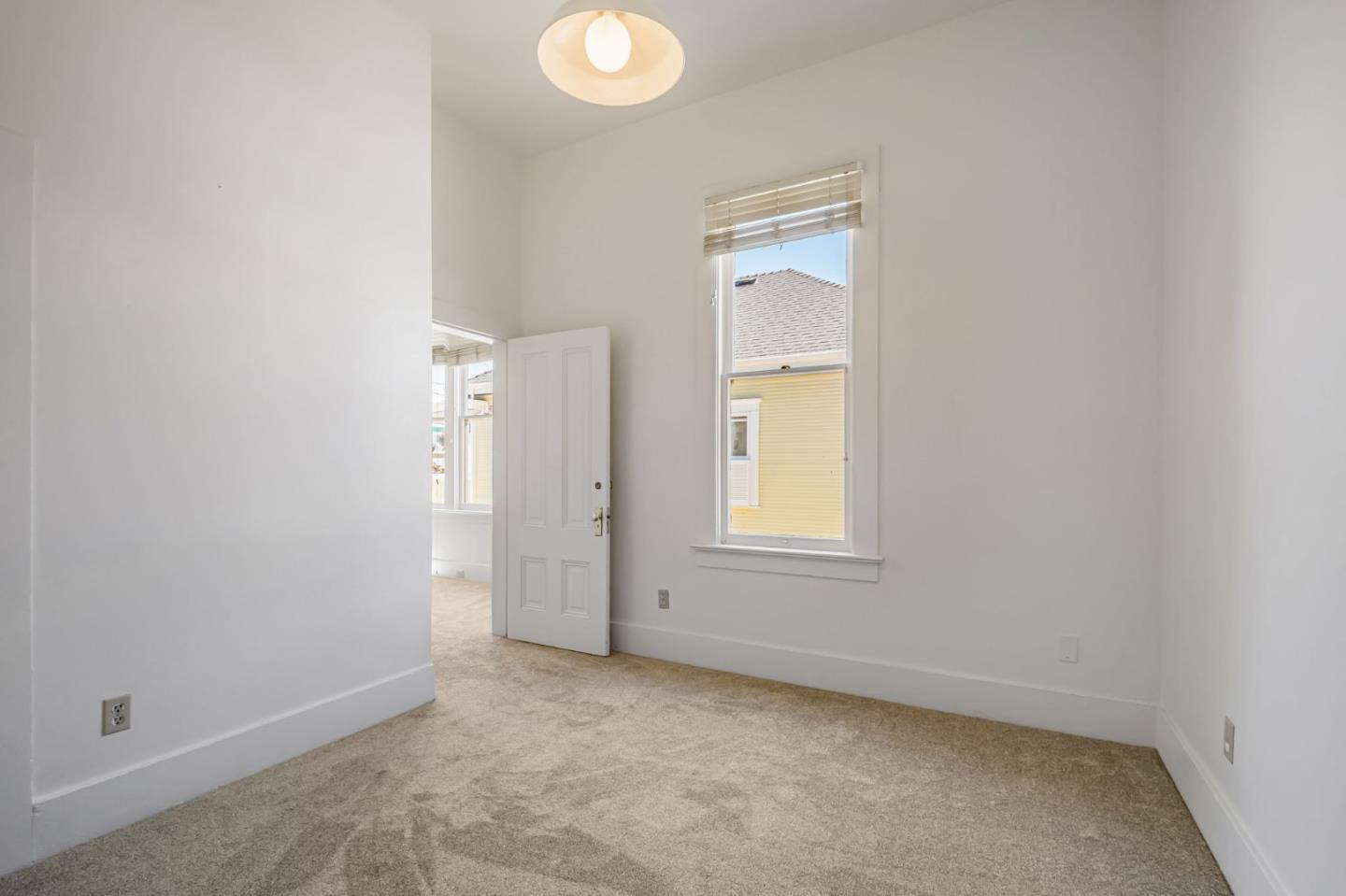 120 Maple Street Santa Cruz, CA 95060 - Photo 22 of 29 an empty room with windows and closet