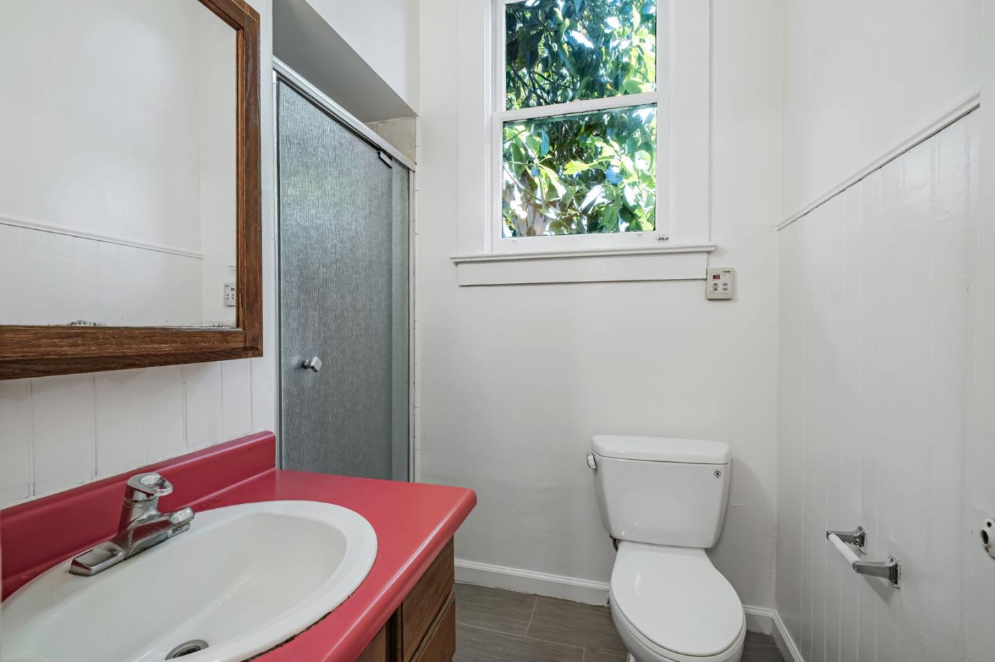 120 Maple Street Santa Cruz, CA 95060 - Photo 25 of 29 a bathroom with a sink a toilet and a mirror