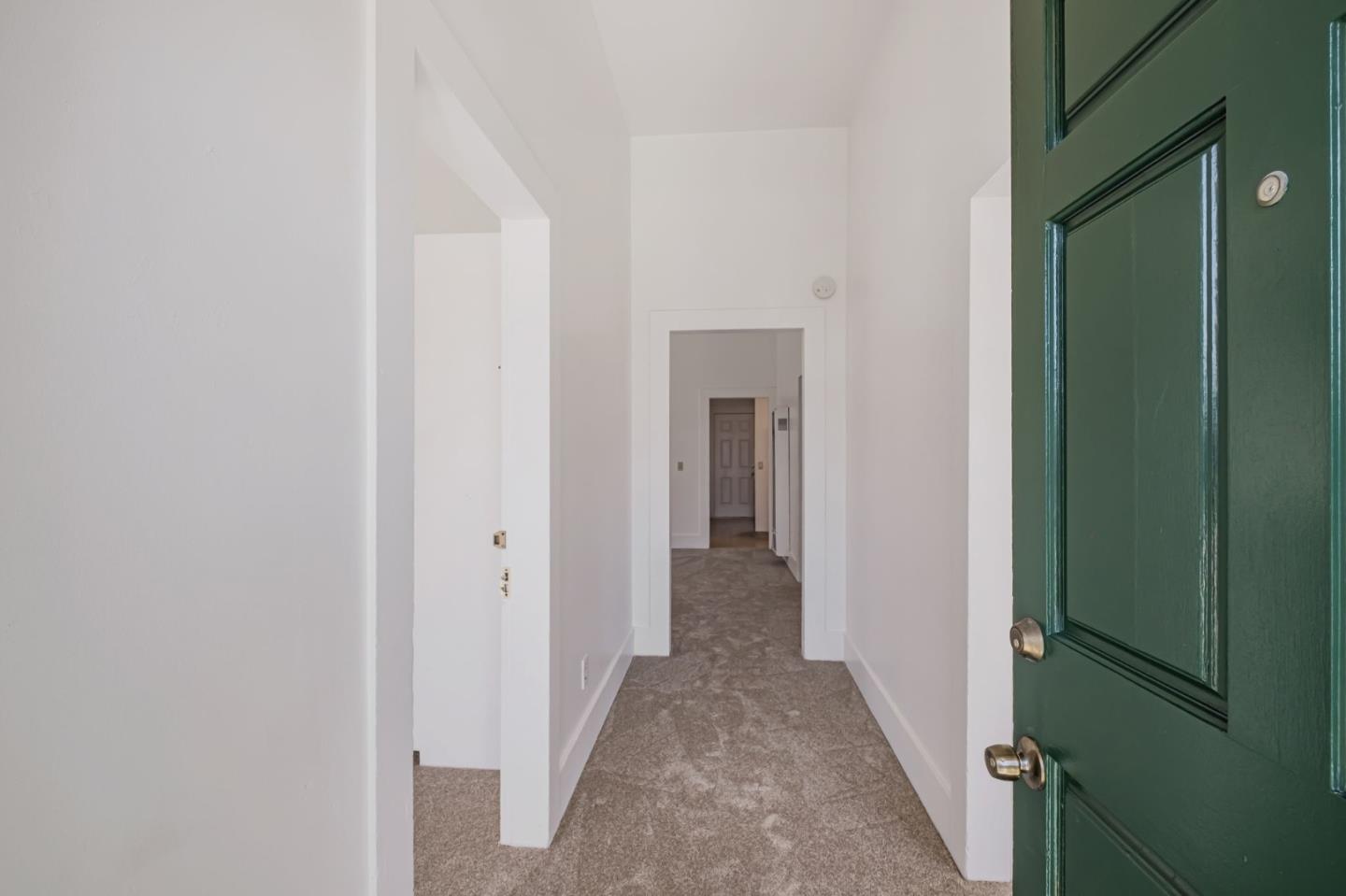 120 Maple Street Santa Cruz, CA 95060 - Photo 6 of 29 a view of a hallway with white walls and door