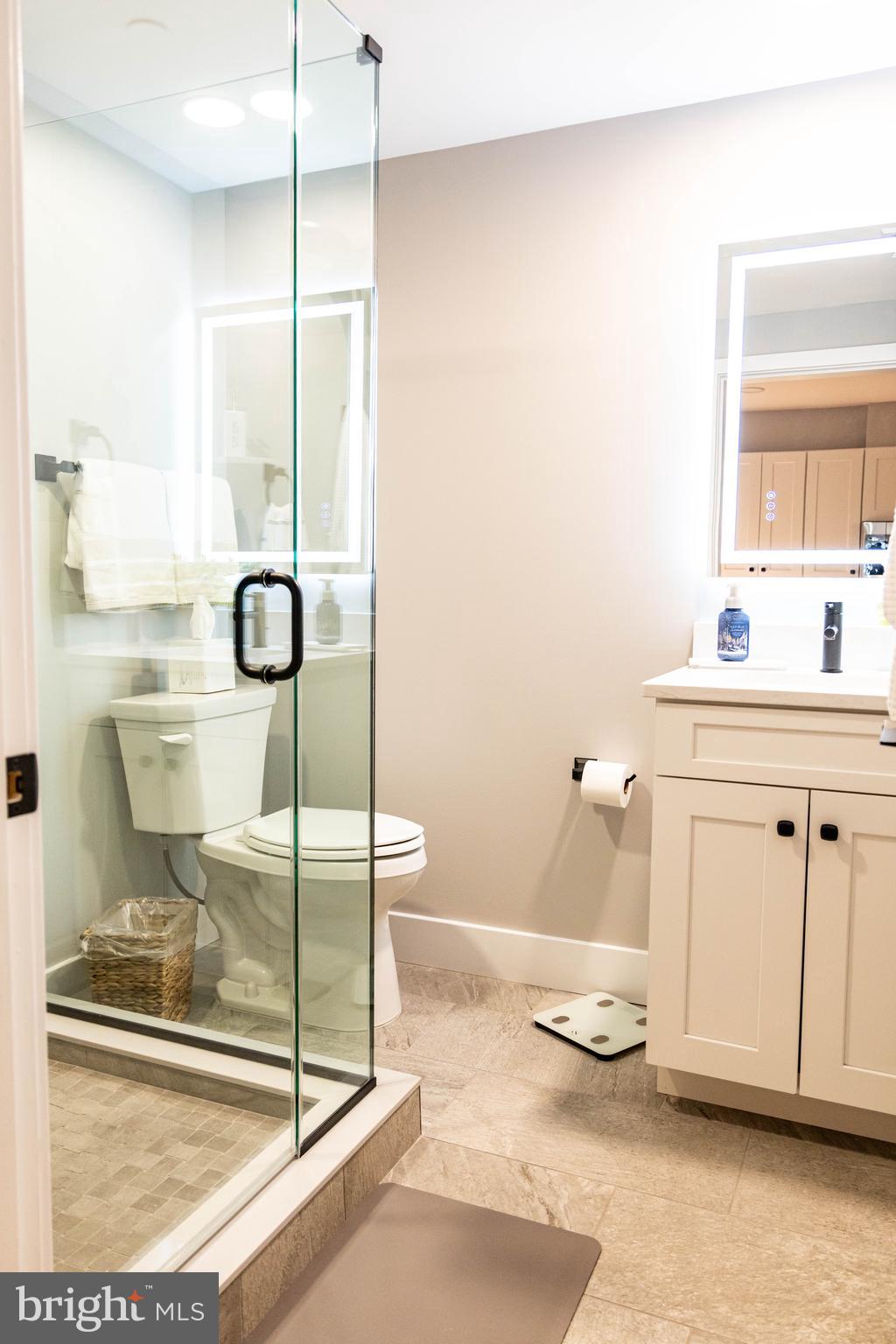 1 South Olive Street, Unit L1 Media, PA 19063 - Photo 11 of 17 a bathroom with a granite countertop sink and a mirror