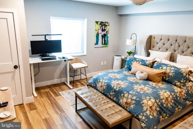 a bedroom with a bed and a television