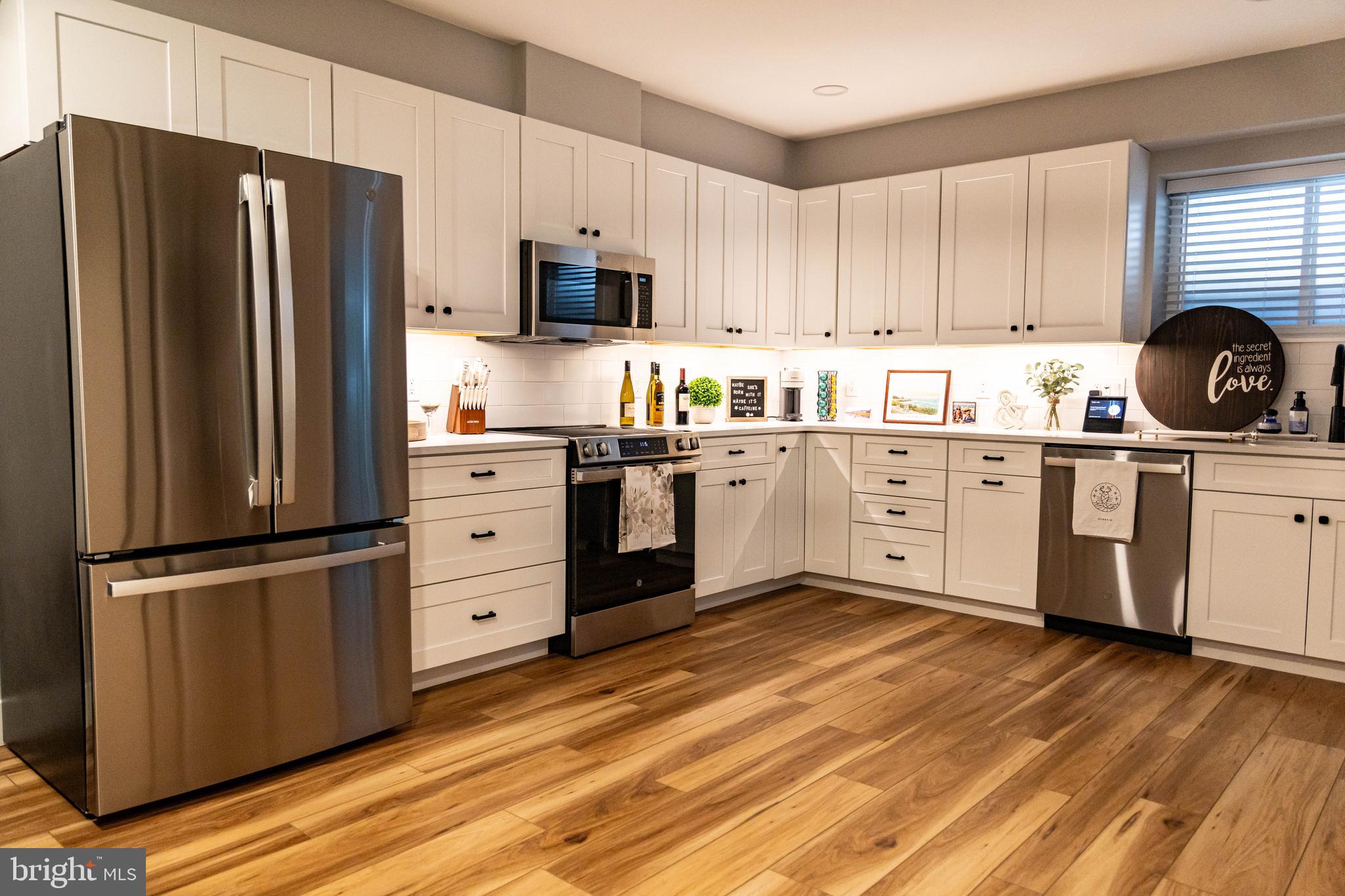 1 South Olive Street, Unit L1 Media, PA 19063 - Photo 5 of 17 a kitchen with stainless steel appliances a refrigerator sink and cabinets