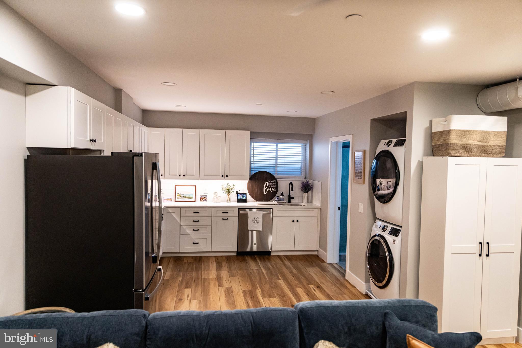 1 South Olive Street, Unit L1 Media, PA 19063 - Photo 6 of 17 a kitchen with stainless steel appliances granite countertop a refrigerator and a stove top oven