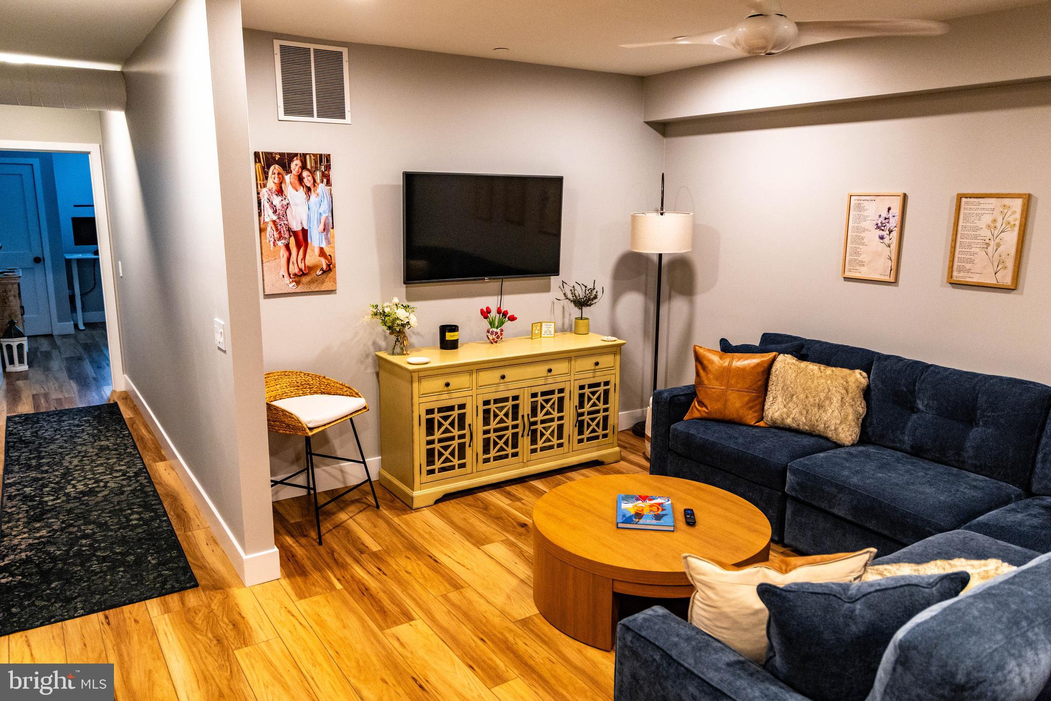 1 South Olive Street, Unit L1 Media, PA 19063 - Photo 9 of 17 a living room with furniture and a flat screen tv