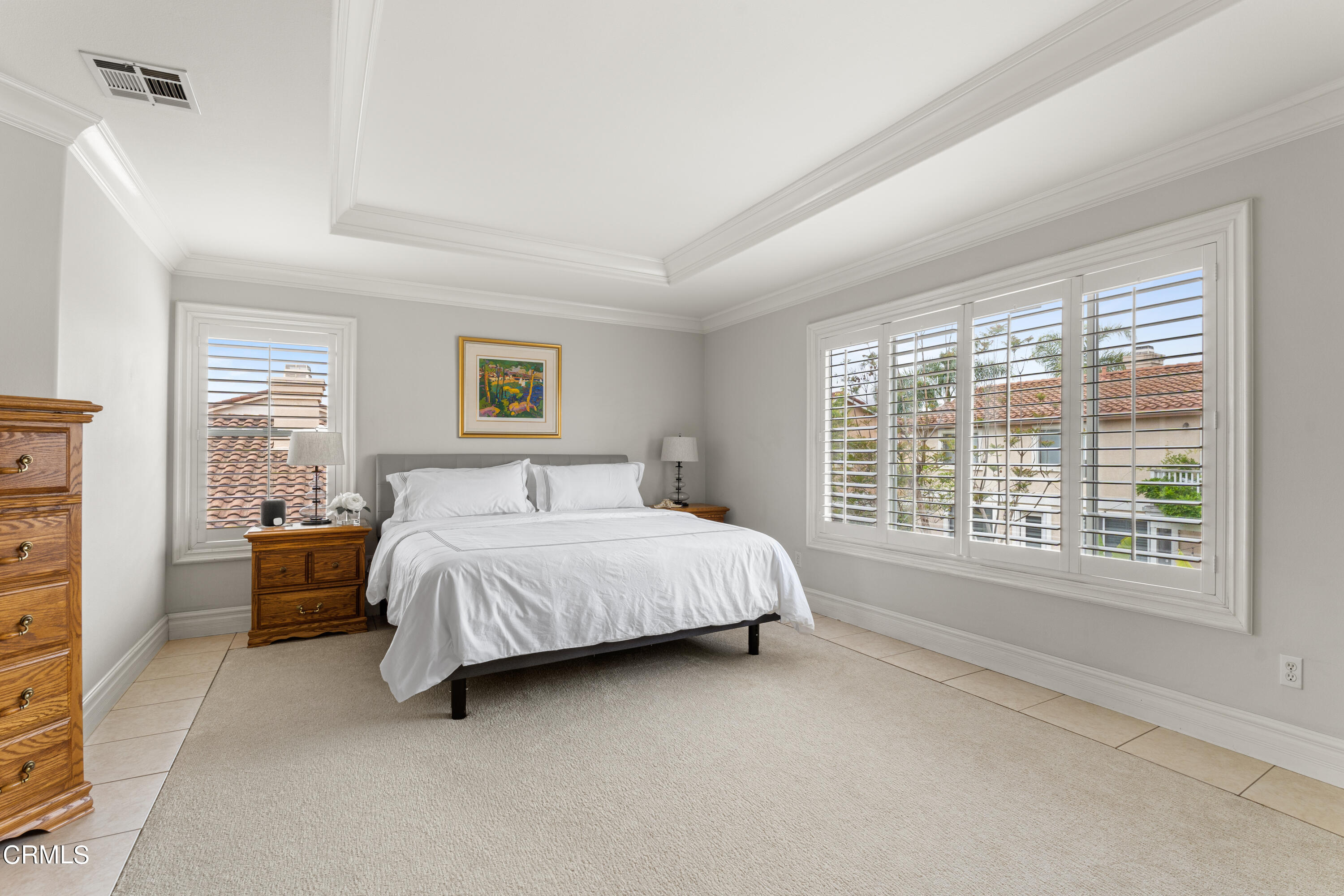 1555 Corte Olivas Camarillo, CA 93012 - Photo 18 of 45 a bed sitting in a spacious bedroom next to a window