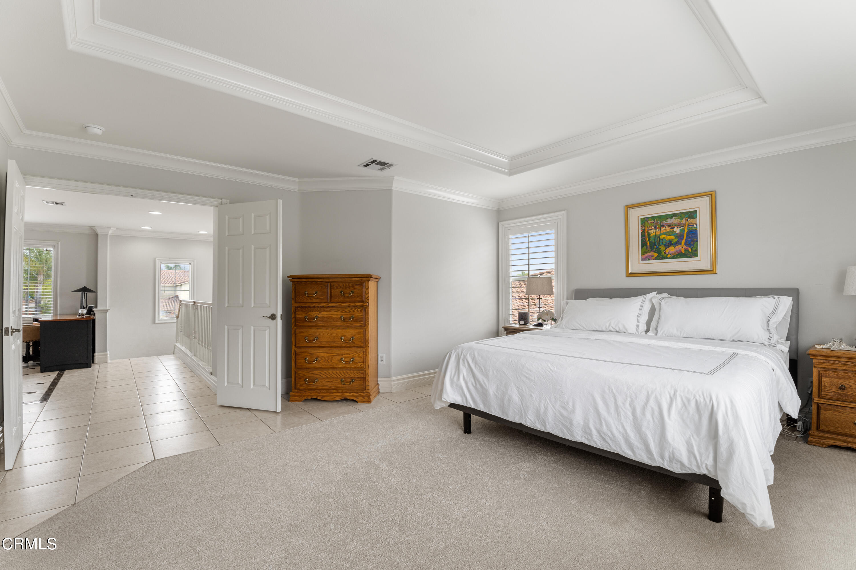 1555 Corte Olivas Camarillo, CA 93012 - Photo 19 of 45 a spacious bedroom with a bed and a couch