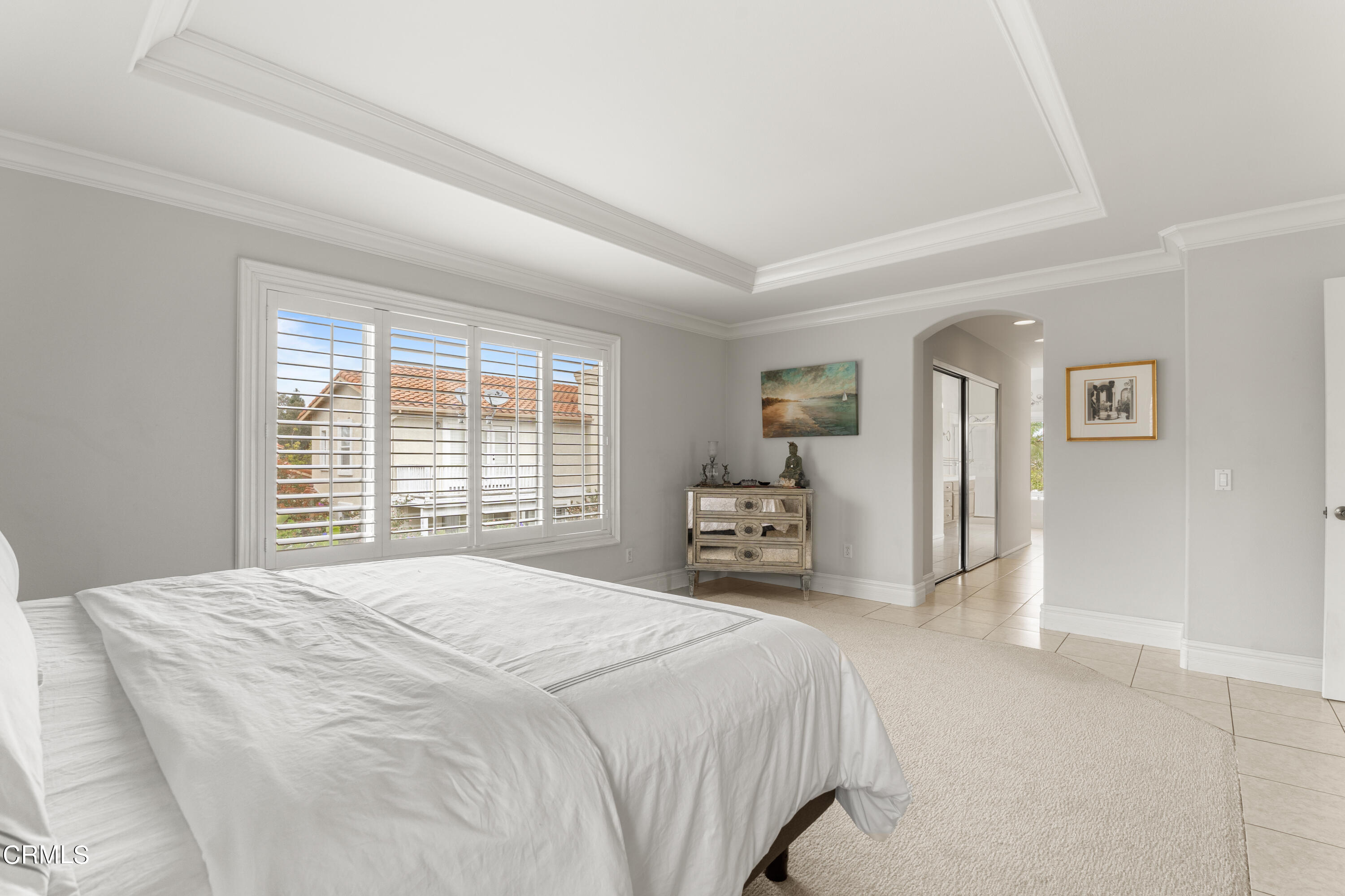 1555 Corte Olivas Camarillo, CA 93012 - Photo 20 of 45 a bedroom with a bed and a large mirror