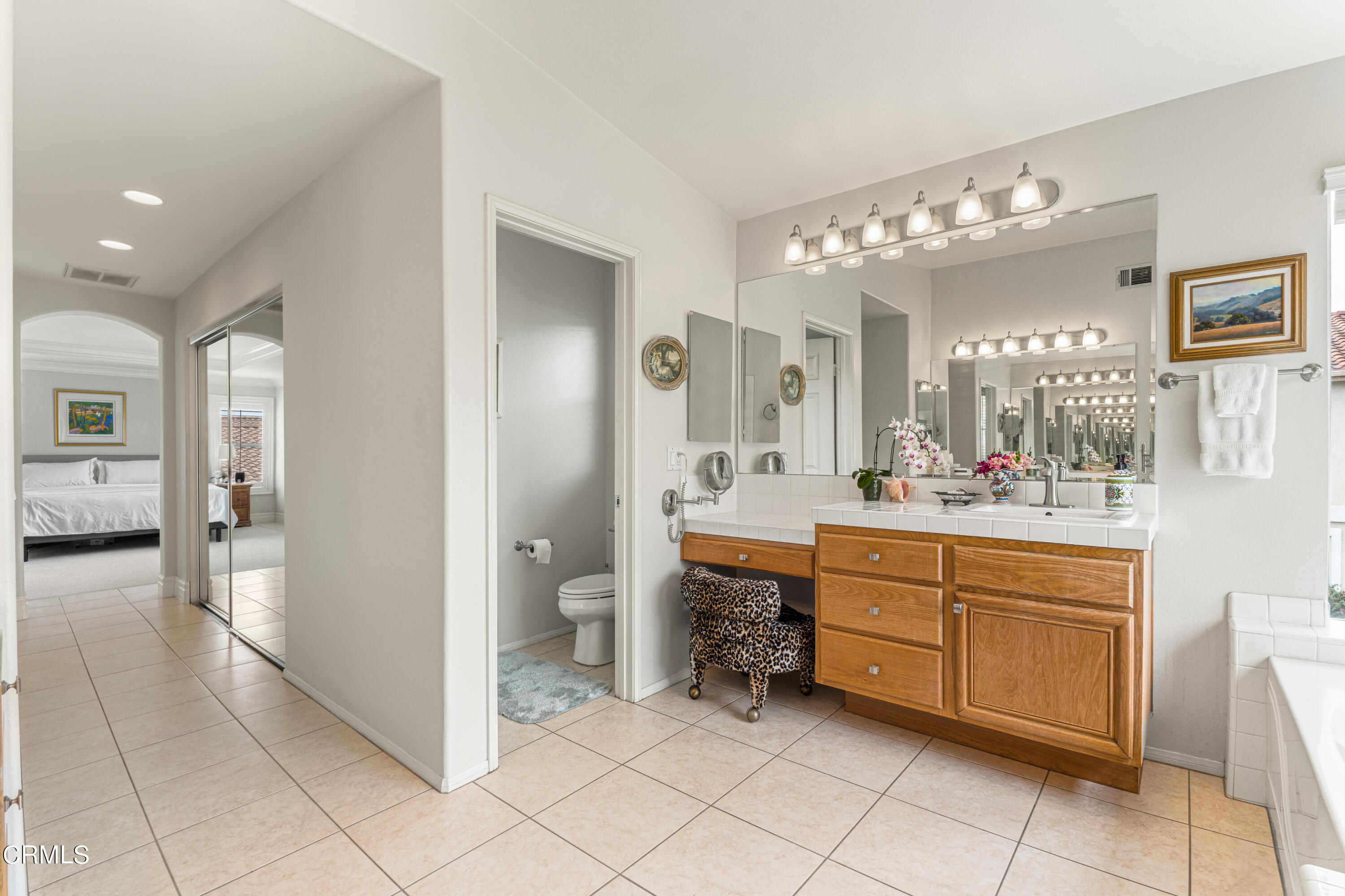 1555 Corte Olivas Camarillo, CA 93012 - Photo 24 of 45 a spacious bathroom with a sink a mirror and a shower