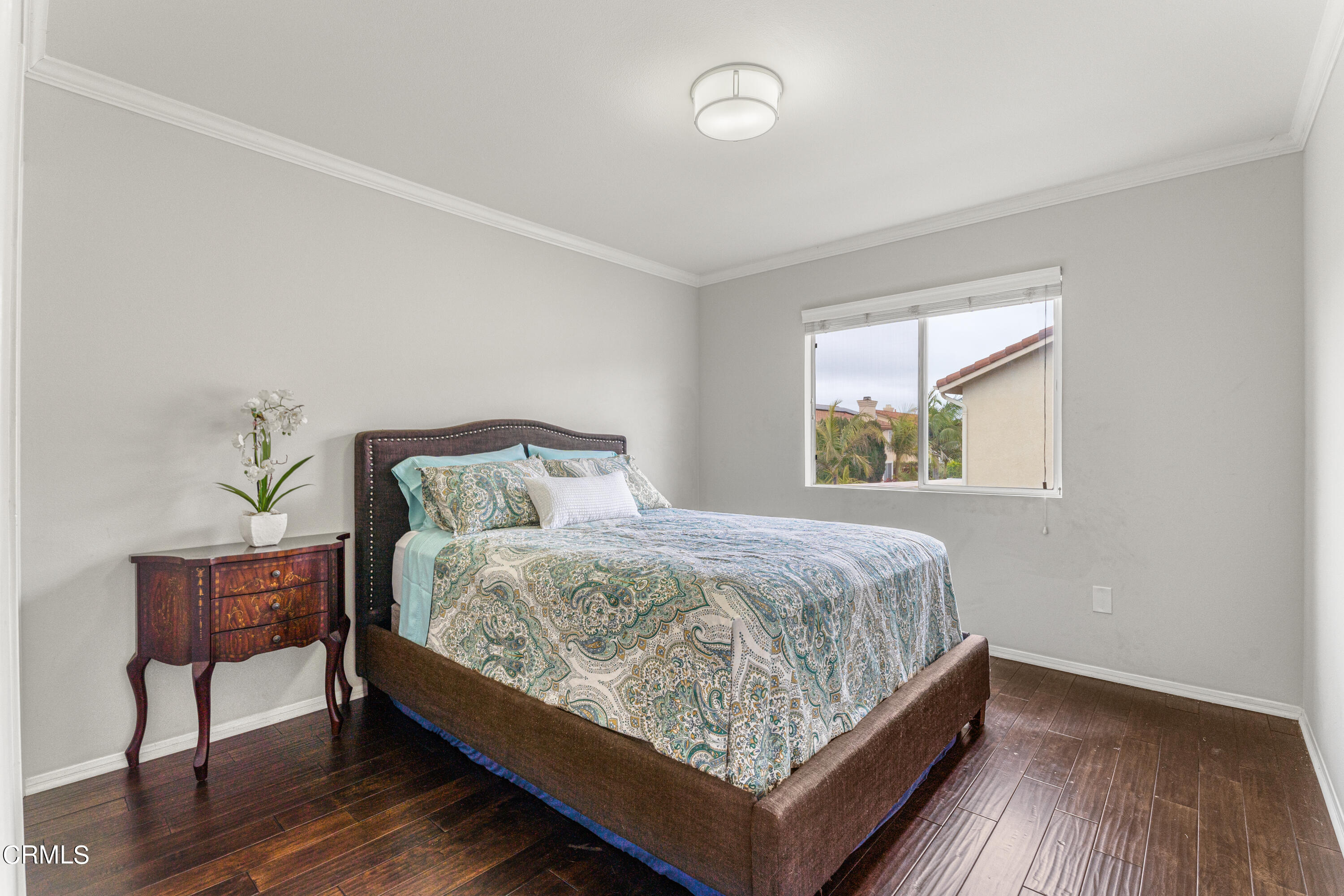 1555 Corte Olivas Camarillo, CA 93012 - Photo 25 of 45 a bed sitting in a bedroom next to a window