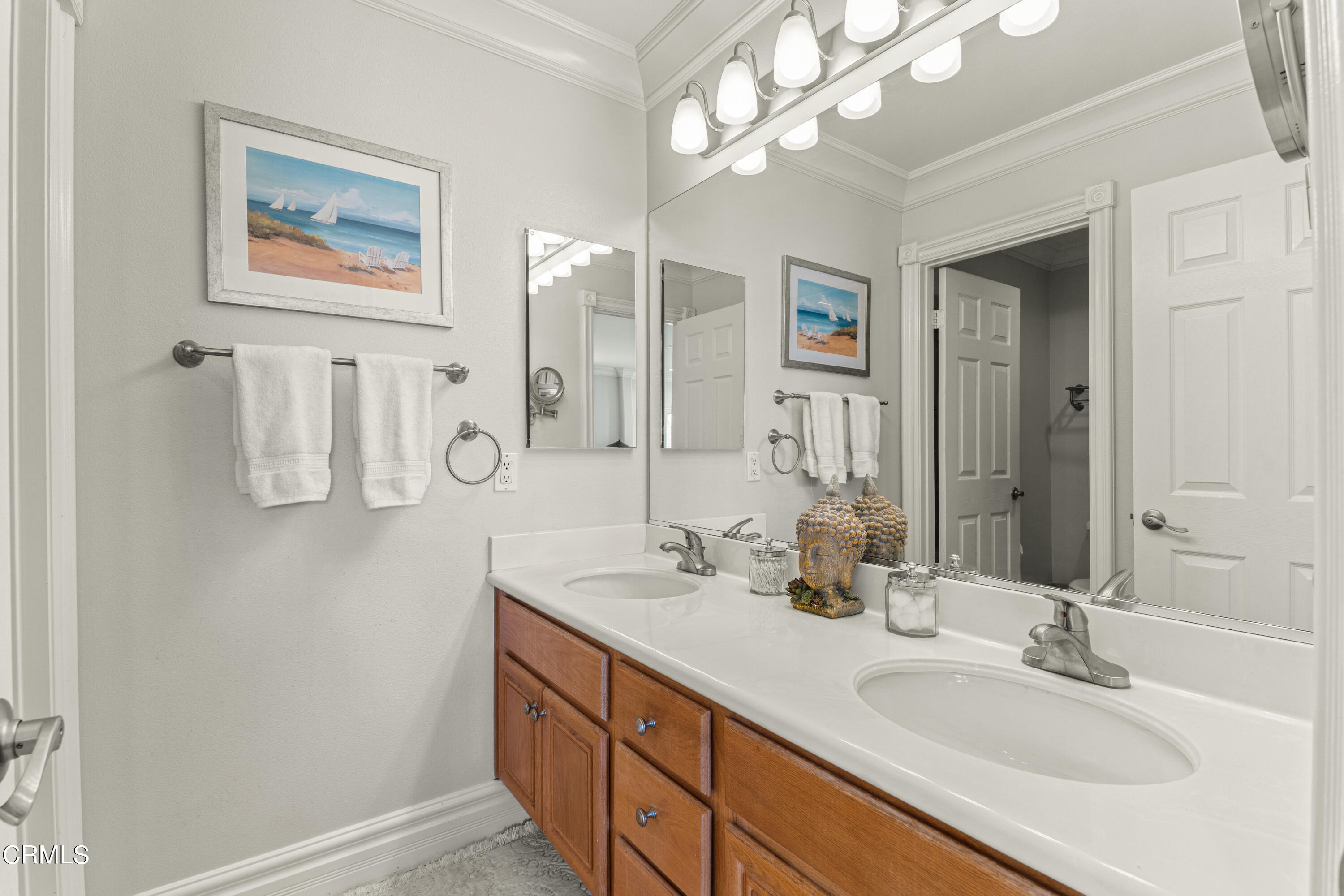 1555 Corte Olivas Camarillo, CA 93012 - Photo 26 of 45 a bathroom with a double vanity sink and a mirror