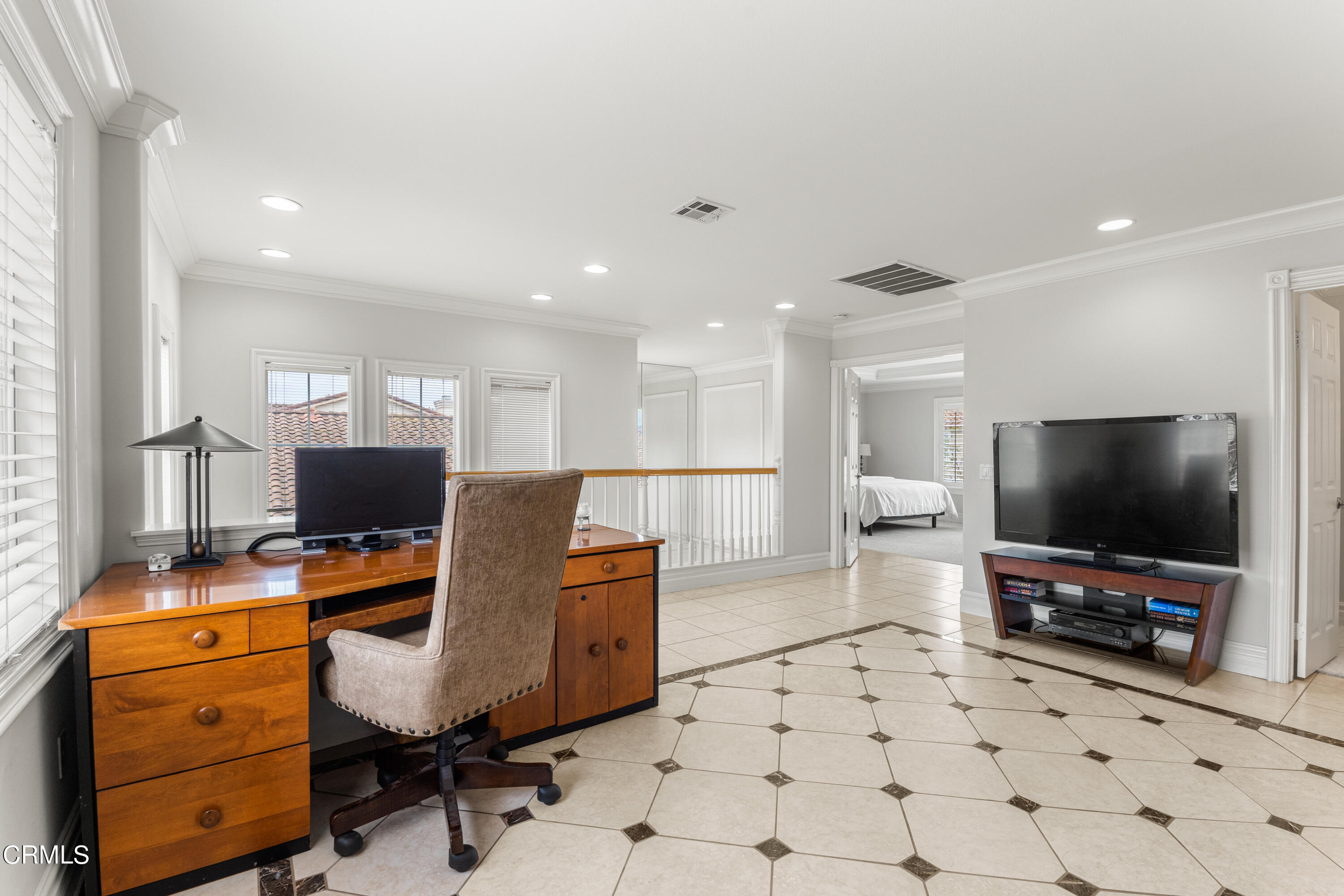 1555 Corte Olivas Camarillo, CA 93012 - Photo 31 of 45 a workspace with furniture and a flat screen tv