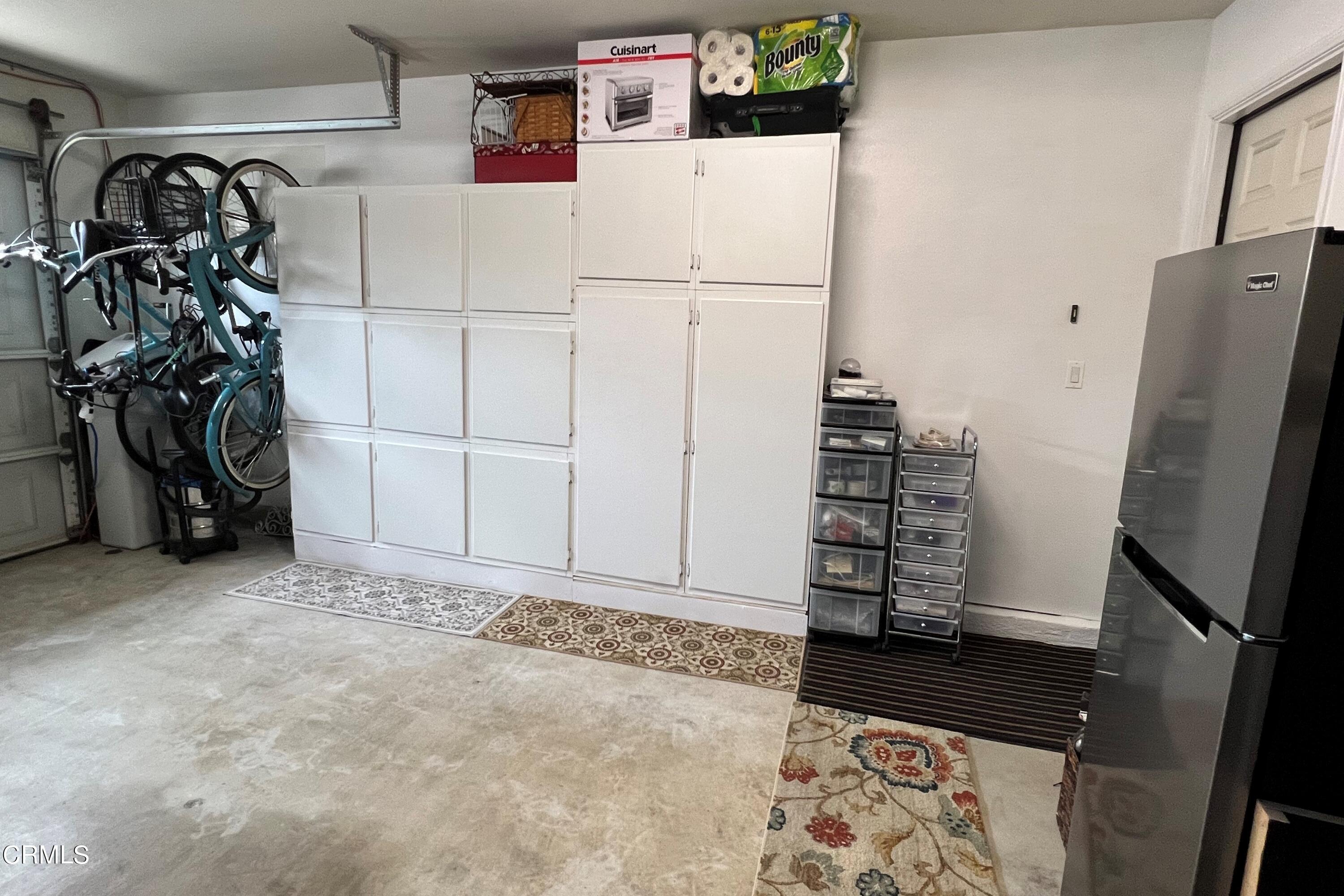 1555 Corte Olivas Camarillo, CA 93012 - Photo 33 of 45 a view of walk in closet with clothes and shoes