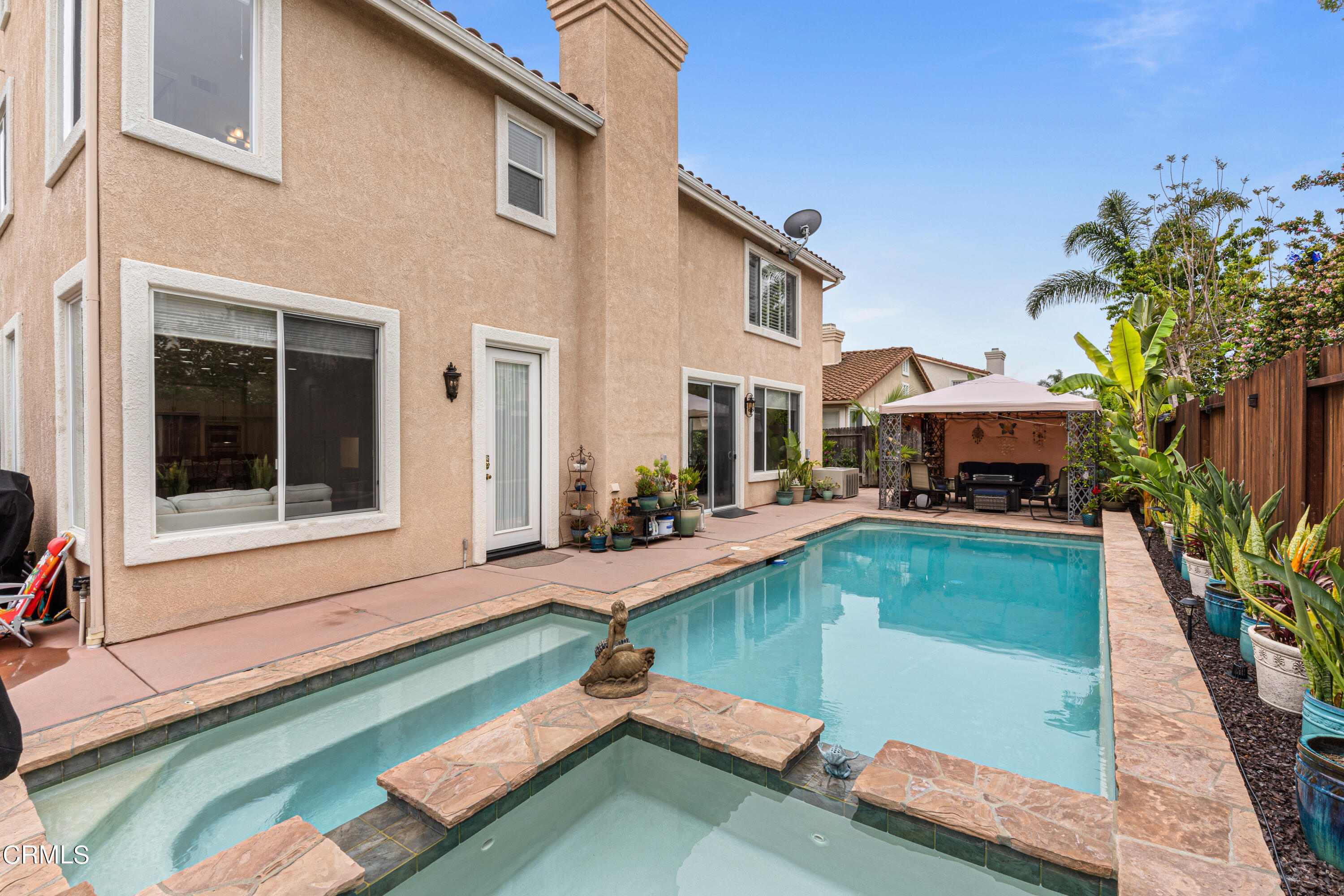 1555 Corte Olivas Camarillo, CA 93012 - Photo 36 of 45 a swimming pool view with a garden space