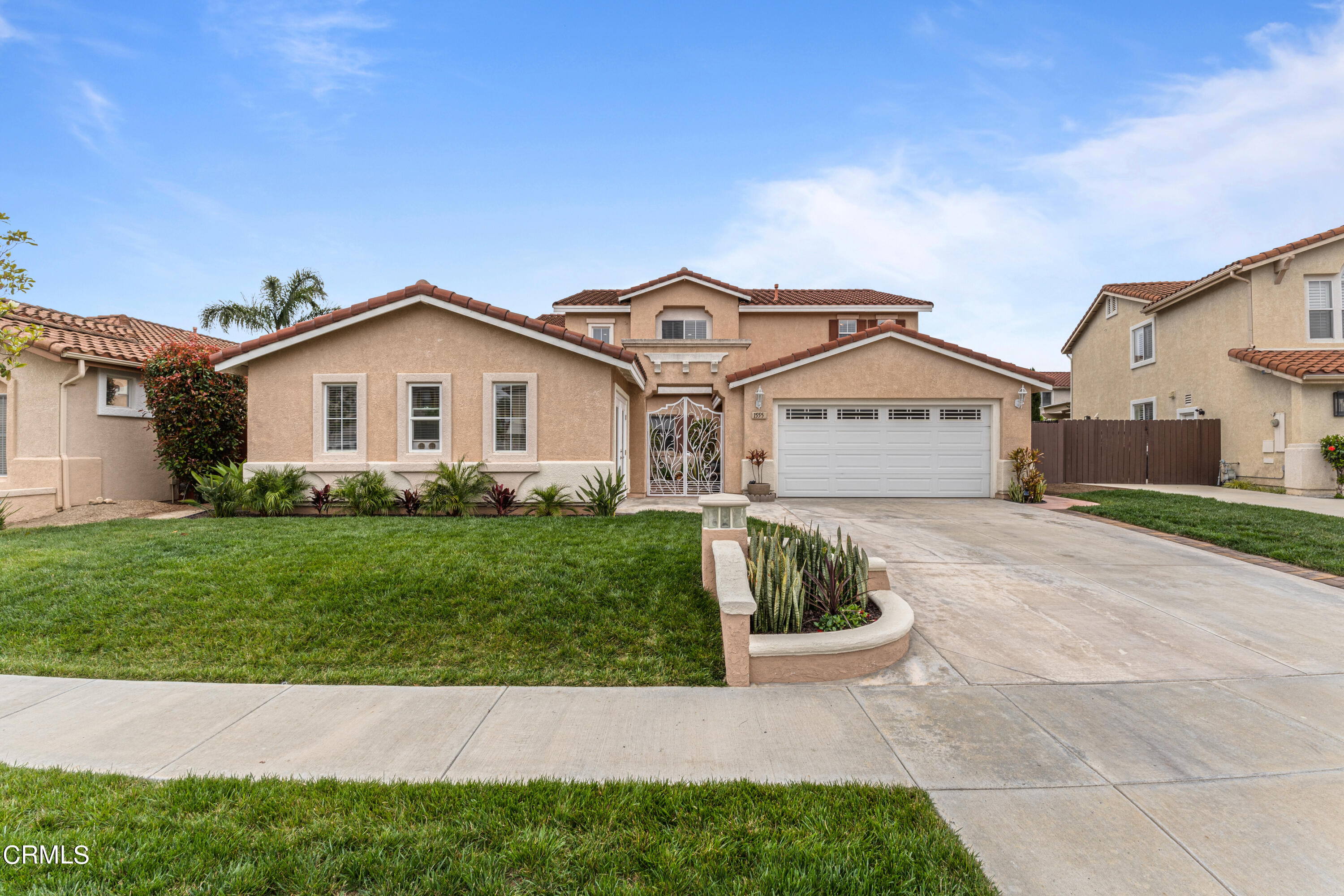 1555 Corte Olivas Camarillo, CA 93012 - Photo 42 of 45 a view of a house with a yard and a garden