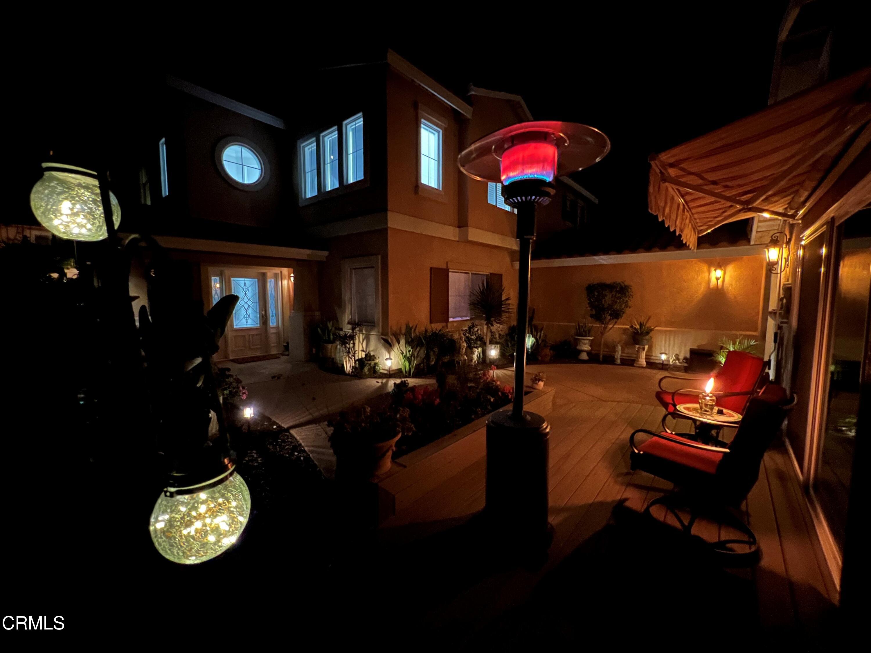 1555 Corte Olivas Camarillo, CA 93012 - Photo 7 of 45 a dining room with furniture and a chandelier